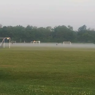 Early morning, fog covering the soccer fields