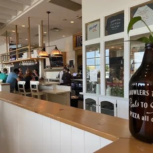 a beer bottle with a flower in it