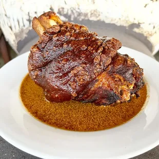 Smoked crispy skin ham hock with maple &amp; mustard jus.