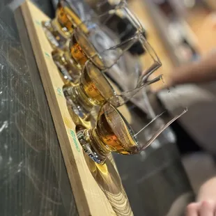 a row of glasses of whiskey