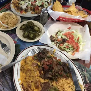 Nacho plate, and the number 7, enchilada, beef fajitas, and a tostada!