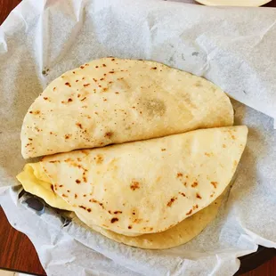 two breakfast tacos ($1.69 each). bacon &amp; egg and potato &amp; egg.