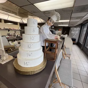 a baker decorating a cake