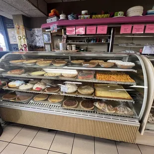a display case filled with pastries