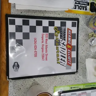 a menu and a cup of coffee