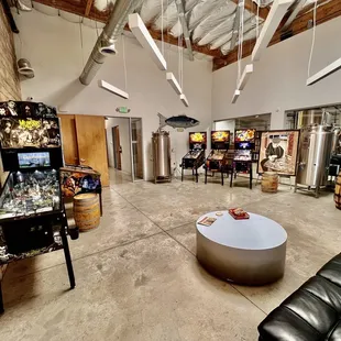 a game room with pinball machines
