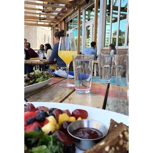 a plate of food and a glass of wine