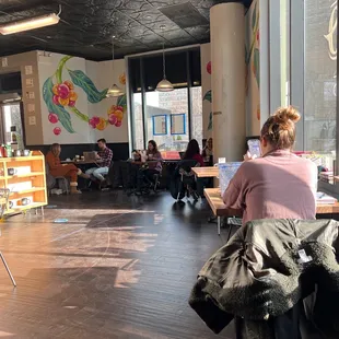 a woman sitting at a table