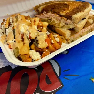 a plate of food with a sandwich