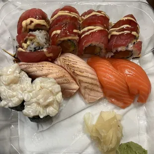 To-go order of nigiri and a roll. Creamy scallop, seared salmon and king salmon