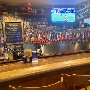 Lots of beer on draft and love all the badges on the walls