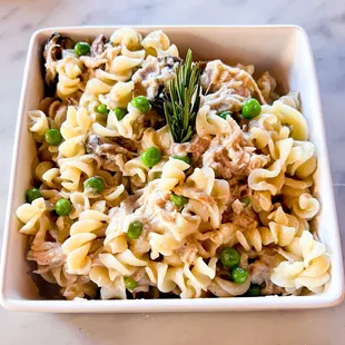 Chicken Tetrazzini with rotisserie chicken, mushrooms, peas, and our white wine, rosemary,garlic cream sauce