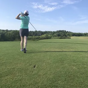 Teeing off a Par 5 at the Heron Ridge Golf Course.