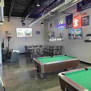 Pool with tables to sit down and eat.