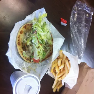 The gyro opened up with fries.