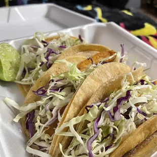 3 Fish Tacos with cabbage and chipotle sauce.