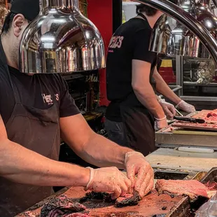 butchers preparing meat