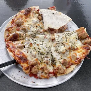 Personal pizza with Italian sausage, mushrooms, &amp; onion... delicious!!!  Also HOT out of the oven.