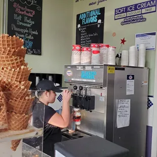 Watching the vanilla soft icecream being added to the mini chocolate chips, salted peanuts, Caramel and Waffle cone pieces.  6/18/2023