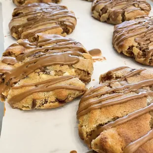 a tray of cookies drizzled with chocolate