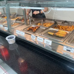 a buffet with a variety of food items