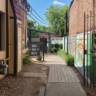 Entrance. It&apos;s down the alley and through the yard. But, you didn&apos;t hear that from me...