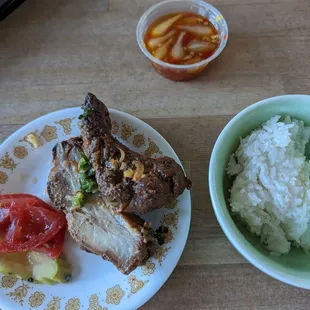 Half portion of charcoal grilled ribs and coconut cream rice, reheated.
