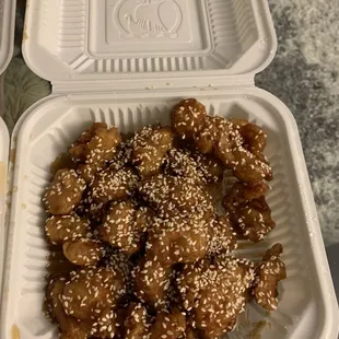 two take out containers of food