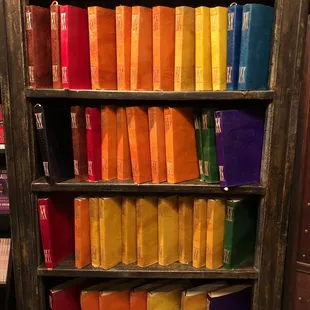 Leather bound books in a rainbow of colors.