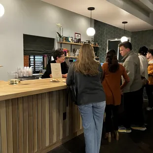 a group of people at a counter