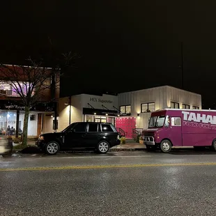a purple van and a black car