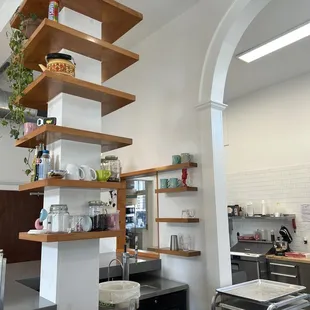 a kitchen with open shelvings