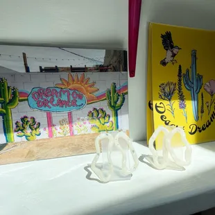 We have exclusive art prints and jewelry!