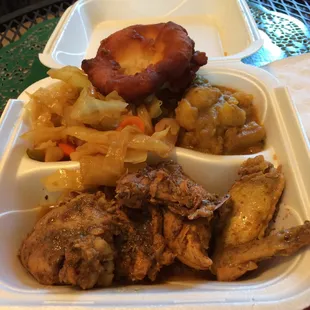 Jerk chicken with cabbage and curry potatoes.