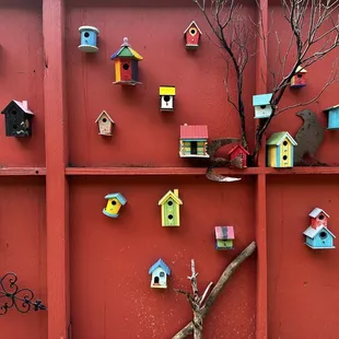 a display of colorful birdhouses