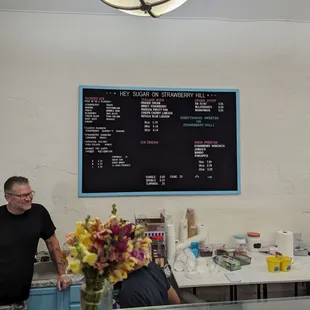 a man standing in front of a counter