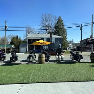 a group of motorcyclists parked in a parking lot