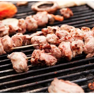 meat skewers on a grill
