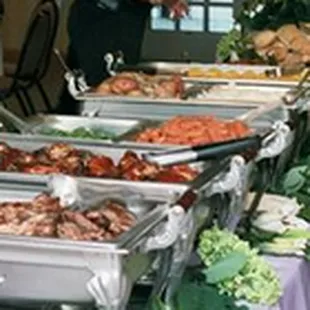 a buffet of meat and vegetables