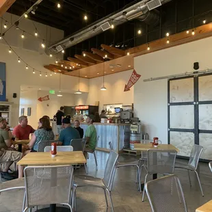 a group of people sitting at tables