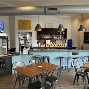 a view of a restaurant with tables and chairs