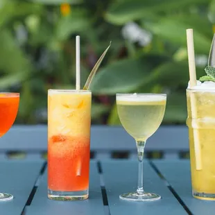 three different types of drinks on a table