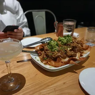 Pulled pork nachos and lavender gin drink