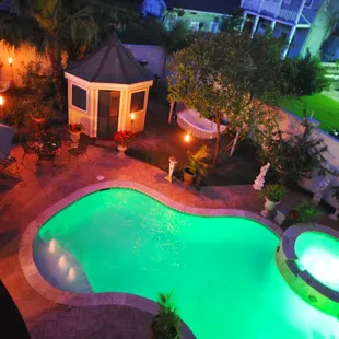 Night view of the pool and garden from the balcony of the Garden Suite