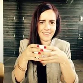 Laura E.
