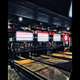 a row of bowling tables