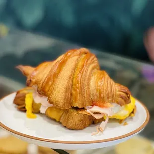 Turkey tomato egg cheese croissant  sandwich