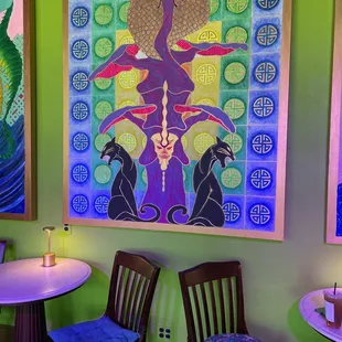 two chairs and a table in a brightly lit room