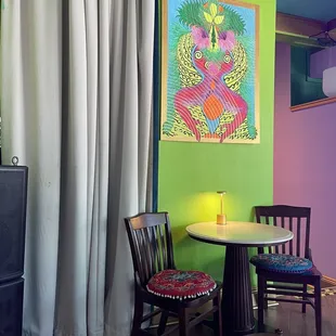 a table and chairs in a brightly colored room