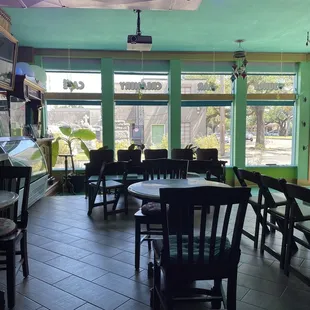 an empty restaurant with tables and chairs